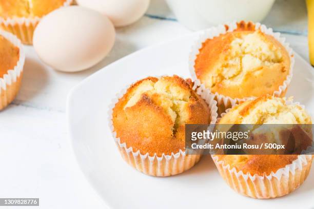 high angle view of cupcakes on table - muffin top stock-fotos und bilder