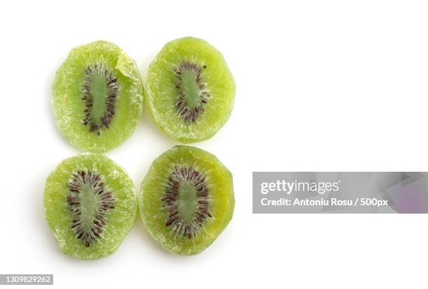 close-up of kiwi against white background - dried food stock pictures, royalty-free photos & images