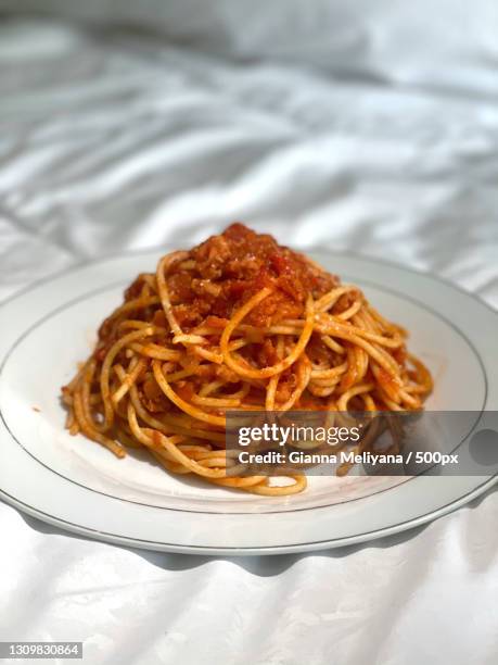 high angle view of noodles in plate on table,jakarta,indonesia - spaghetti bolognese fotografías e imágenes de stock