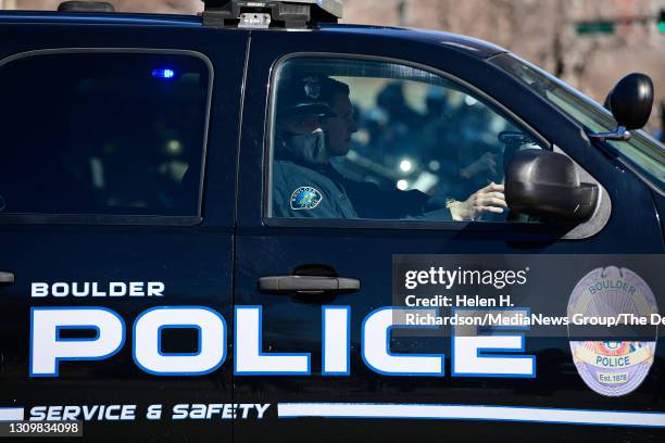 Boulder Police officers gather on Colfax avenue after the arrival of the hearse carrying the casket of fallen Boulder police officer Eric Talley...