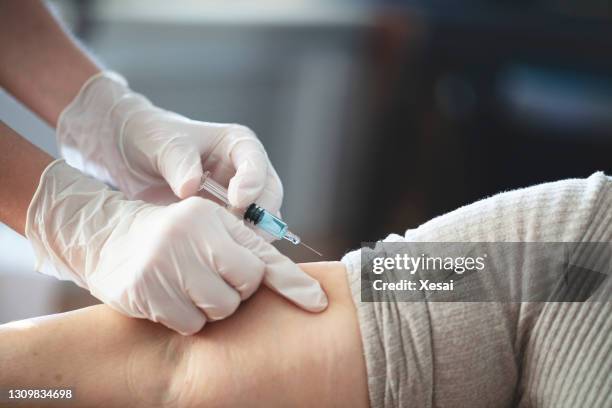 covid-19 liquid vaccine injection - subcutaneous injection stock pictures, royalty-free photos & images
