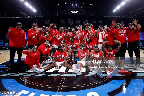 The Houston Cougars celebrate after defeating the Oregon State Beavers in the Elite Eight round of the 2021 NCAA Men's Basketball Tournament at Lucas...