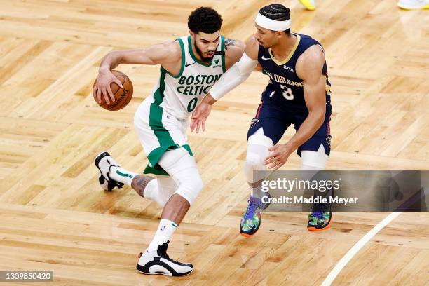 Josh Hart of the New Orleans Pelicans defends Jayson Tatum of the Boston Celtics during the second half at TD Garden on March 29, 2021 in Boston,...