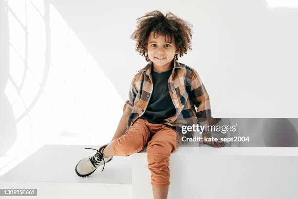 sitting toddler and looking at camera - natural black hair stock pictures, royalty-free photos & images