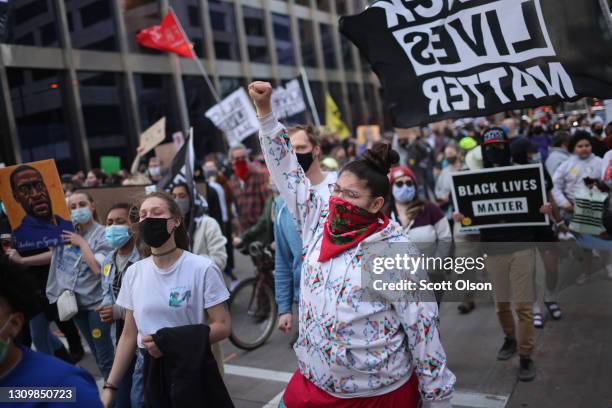 Activists demonstrate near the Hennepin County Government Center following the start of the trial of former Minneapolis police officer Derek Chauvin...