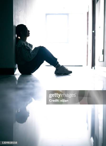 sadness teenage girls sitting in tunnel - bad habit stock pictures, royalty-free photos & images