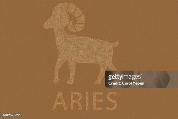 aries horoscope sign in paper craft brown background - ram stockfoto's en -beelden