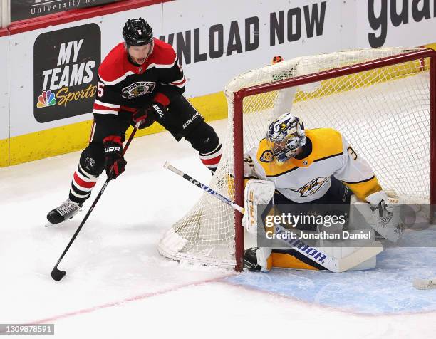 Connor Murphy of the Chicago Blackhawks moves to shoot against Pekka Rinne of the Nashville Predators at the United Center on March 28, 2021 in...