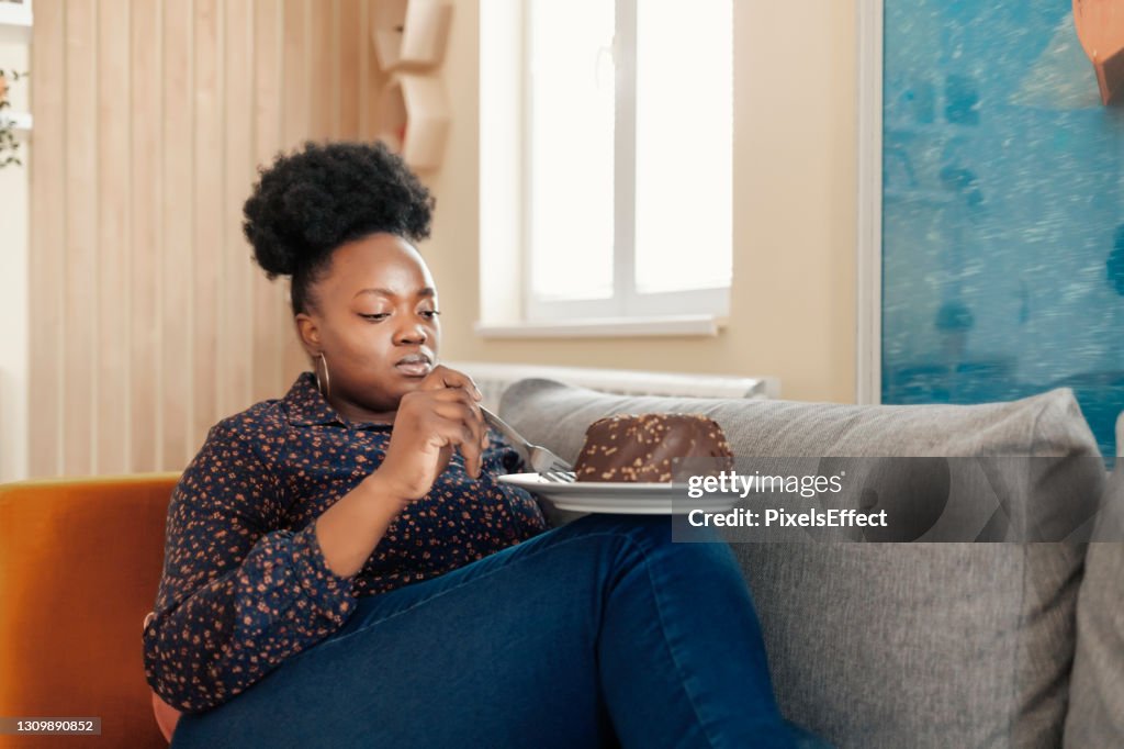 Overweight Woman Eating Sweet Cake