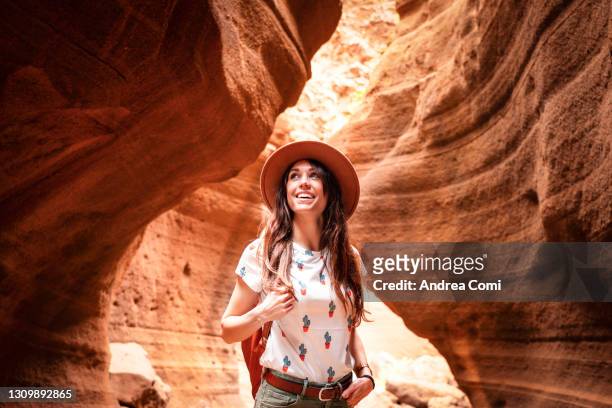 tourist exploring a canyon in grand canary. canary islands, spain - journey fotografías e imágenes de stock