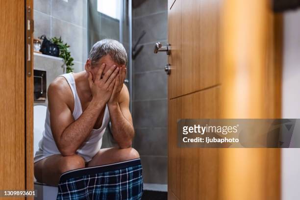 your thoughts determine how your day goes - men taking a dump stock pictures, royalty-free photos & images