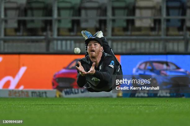 Glenn Phillips of New Zealand dives but drops a catch during game two of the International T20 series between New Zealand and Bangladesh at McLean...