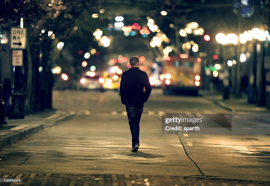 Silhouette walking in downtown seattle