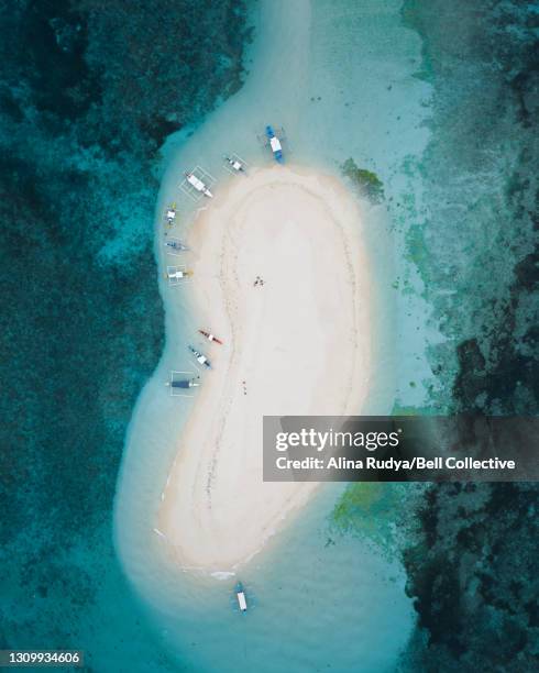 aerial view of the boats by the sandy beach in the philippines - pacific ocean stock pictures, royalty-free photos & images