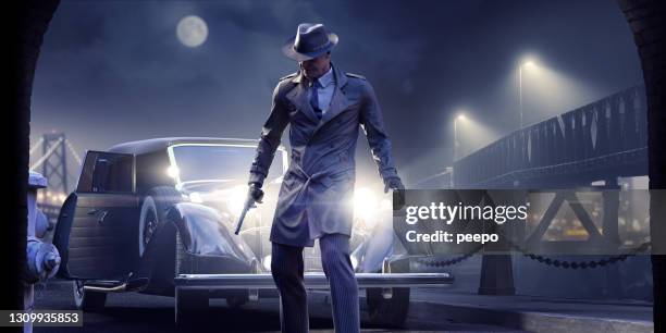 film noir detective of gangster holding gun voor auto koplampen op mistige nacht in de buurt van brug met verre stadslichten - film noir style stockfoto's en -beelden