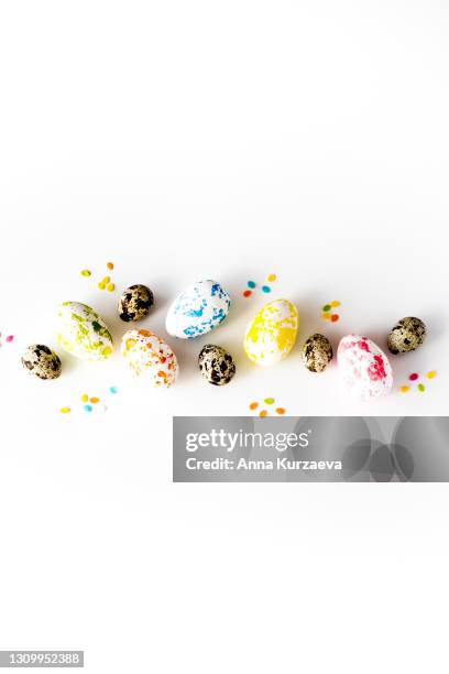 painted easter eggs and quail eggs on white background. isolated on white. image with copy space. - easter egg white background stock pictures, royalty-free photos & images