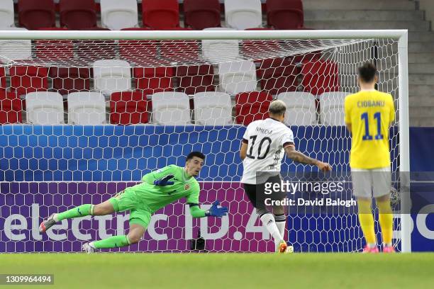 Daniel Vlad of Romania dives for the ball as Lukas Nmecha of Germany hits the post from the penalty spot during the 2021 UEFA European Under-21...