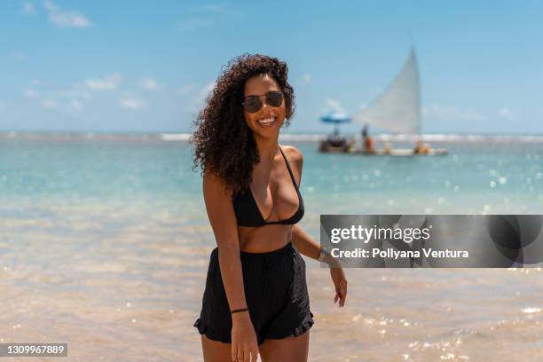 afro model woman on the beach - beach model stock pictures, royalty-free photos & images