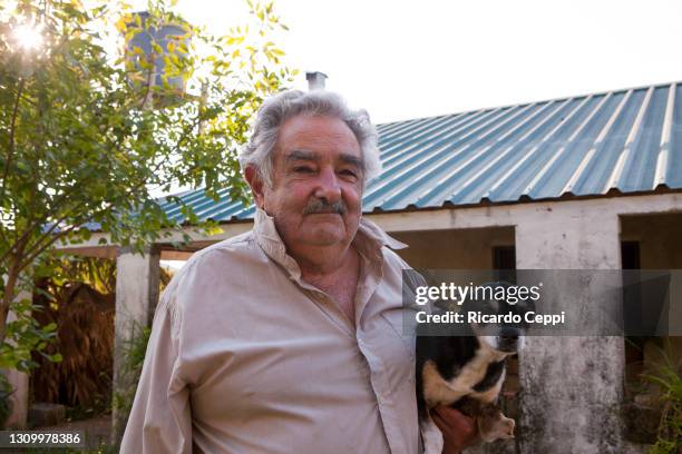 President of Uruguay José Mujica plays with his dog in his farm on April 13, 2011 in Montevideo, Uruguay. In the early 1960s, he joined the newly...