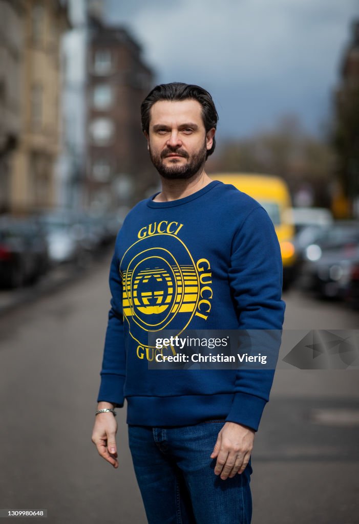 Daniel Kozniewski is seen wearing GUCCI sweater in blue NUDIE JEANS