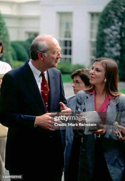 Senator Phil Gramm from Texas talks with reporters outside the West Wing of the White House after attending meeting with President George H.W....
