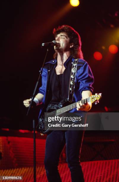 American Pop musician Richard Marx plays guitar as he performs onstage during his 'Repeat Offender' world tour at Radio City Music Hall, New York,...