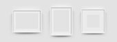 Photo picture frames on wall, vector white mockups or empty posters. Empty photo frames mockups for pictures or photograph, realistic 3D blank templates