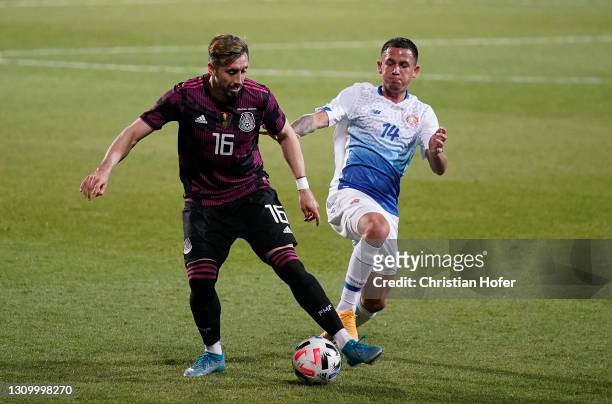 Hector Herrera of Mexico battles for possession with Cristopher Antonio Nunez Gonzalez of Costa Rica during the International Friendly match between...