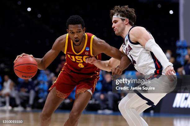 Evan Mobley of the USC Trojans dribbles against Corey Kispert of the Gonzaga Bulldogs during the second half in the Elite Eight round game of the...