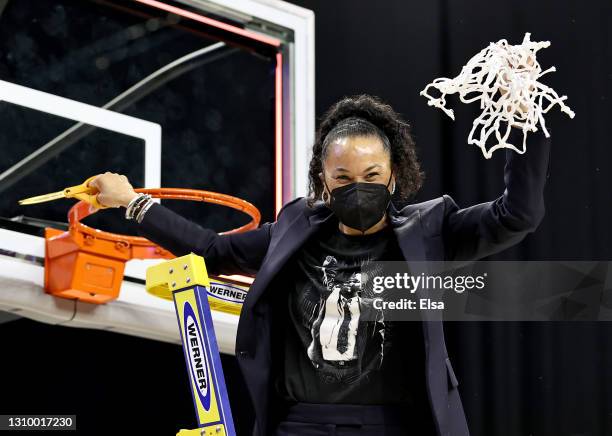 Head coach head coach Dawn Staley of the South Carolina Gamecocks celebrates after cutting the last piece of the net during the Elite Eight round of...