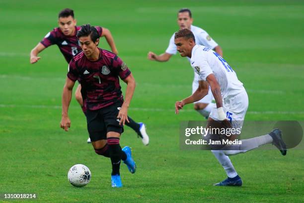 Juan Jose Macias of Mexico fights for the ball with Kervin Arriaga of Honduras during the final match between Honduras and Mexico as part of the 2020...