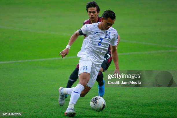 Denil Maldonado of Honduras fights for the ball with Juan Jose Macias of Mexico during the final match between Honduras and Mexico as part of the...