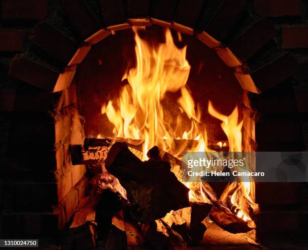 close up of burning fireplace at home - real time stock pictures, royalty-free photos & images