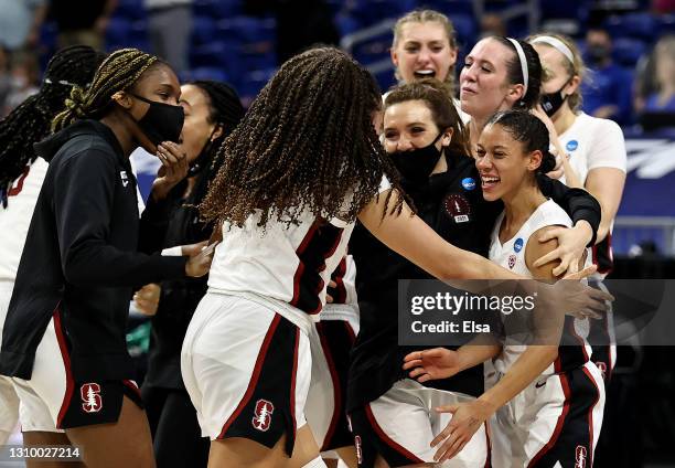 Anna Wilson and Haley Jones of the Stanford Cardinal celebrate the win over the Louisville Cardinals during the Elite Eight round of the NCAA Women's...