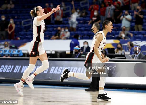 Anna Wilson and Lexie Hull of the Stanford Cardinal celebrate the win over the Louisville Cardinals during the Elite Eight round of the NCAA Women's...