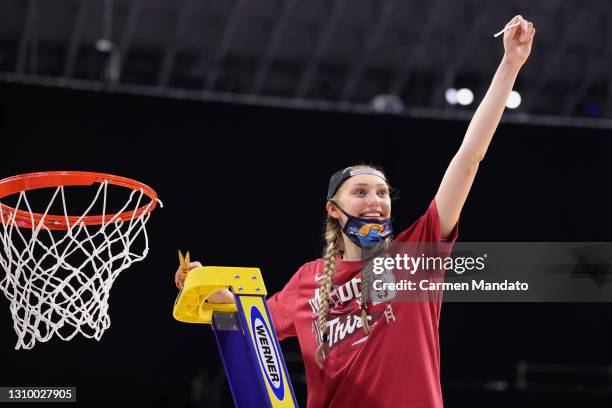 Cameron Brink of the Stanford Cardinal cuts the net after defeating the Louisville Cardinals in the Elite Eight round of the NCAA Women's Basketball...