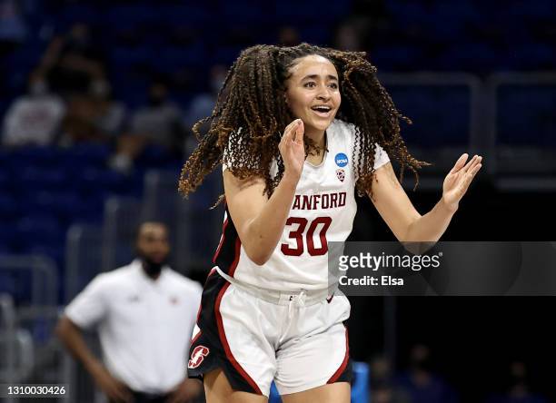 Haley Jones of the Stanford Cardinal celebrates her basket in the second half against the Louisville Cardinals during the Elite Eight round of the...