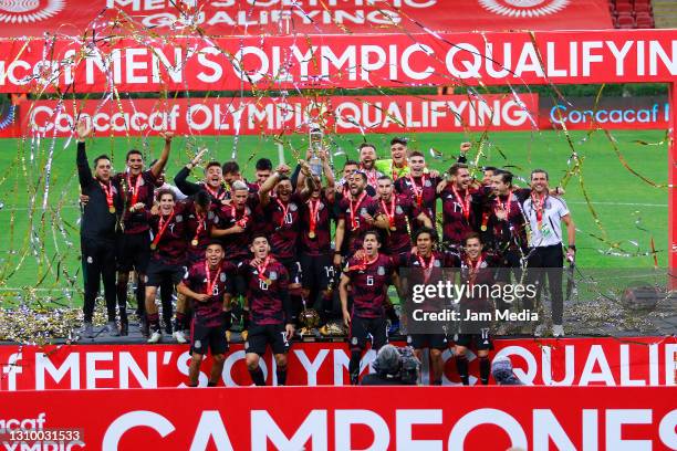 Players of Mexico celebrate with the champion trophy during the final match between Honduras and Mexico as part of the 2020 Concacaf Men's Olympic...