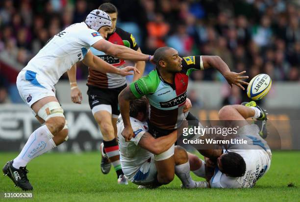 Jordan Turner-Hall of Harlequins is tackled during the Aviva Premiership match between Harlequins and Exeter Chiefs at Twickenham Stoop on October...