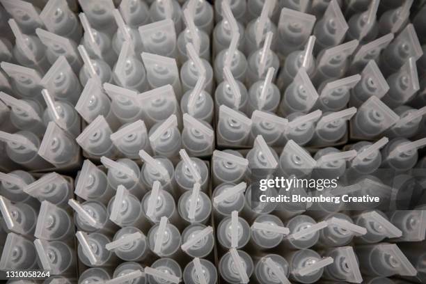 plastic vials of saline solution - saline drip stock pictures, royalty-free photos & images