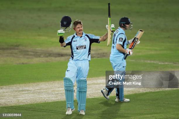 Daniel Hughes of New South Wales celebrates and acknowledges the crowd after scoring a century during the Marsh One Day Cup match between New South...