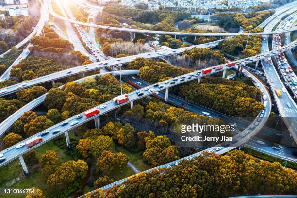 overpass in the modern city of china, shanghai - transportation stock pictures, royalty-free photos & images