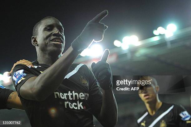 Newcastle United's Senegalese forward Demba Ba celebrates after scoring his third goal from a penalty during the English Premier League football...