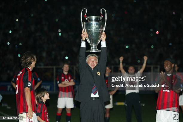Carlo Ancelotti head coach of AC Milan poses for photo with the Uefa Champions League trophy 2002-2003 in Milan on Stadio San Siro, Italy.