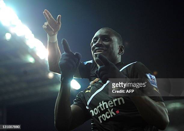 Newcastle United's Senegalese forward Demba Ba celebrates after scoring his third goal from a penalty during the English Premier League football...