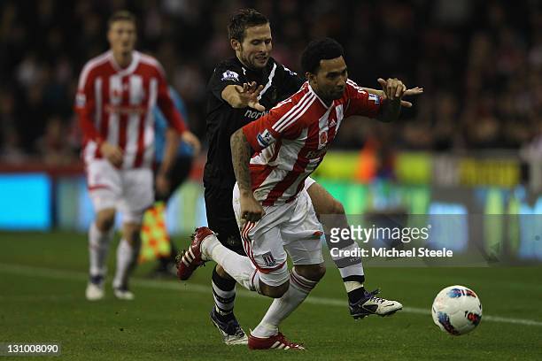 Jermaine Pennant of Stoke City is put under pressure by Yohan Cabaye of Newcastle United during the Barclays Premier League match between Stoke City...