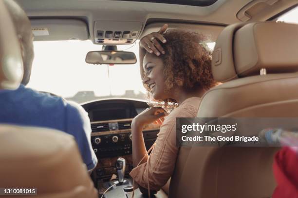 couple talking in front seat of car - passenger point of view bildbanksfoton och bilder