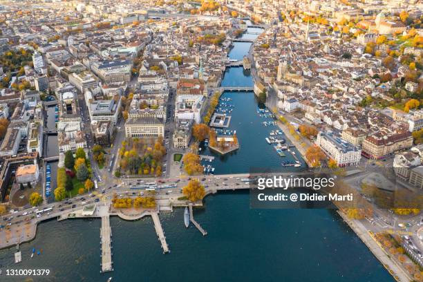 stunning aerial view of zurich old town and the quay facing lake zurich in switzerland - lake zurich switzerland stock pictures, royalty-free photos & images