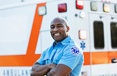 Paramedic in front of ambulance