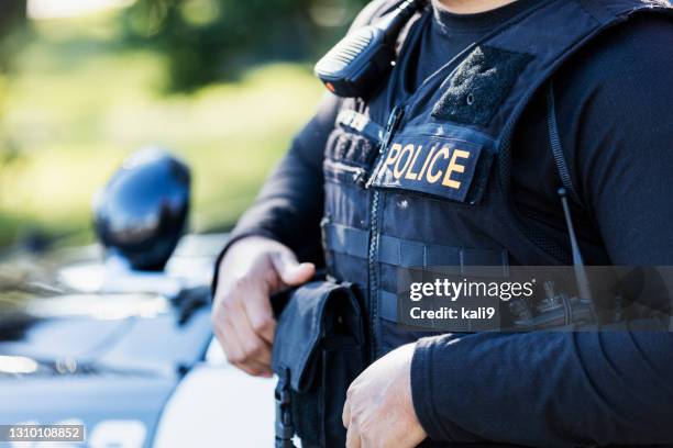 cropped view of police officer - bullet proof vest stock pictures, royalty-free photos & images